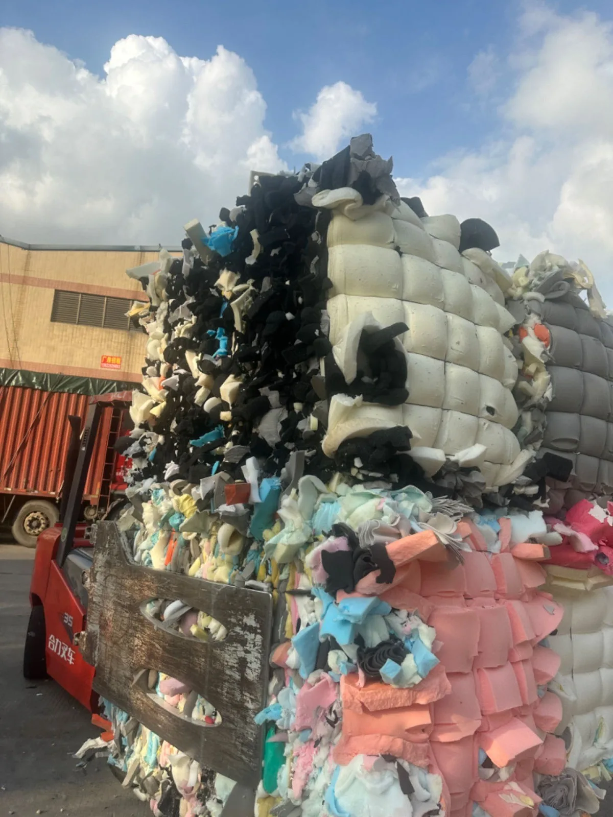 Compressed foam scrap bales being loaded for shipment